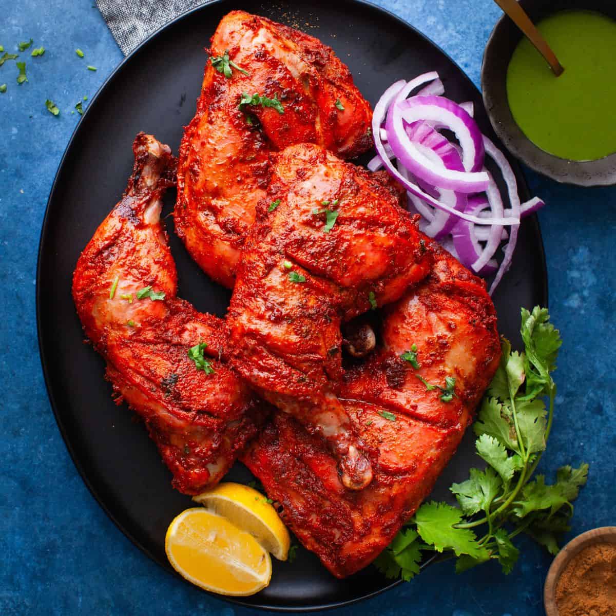 Tandoori chicken on terracotta plate